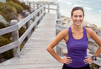 Healthy Woman on boardwalk at beach